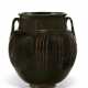 A LARGE BLACK-GLAZED WHITE-RIBBED JAR WITH TWO HANDLES - фото 1
