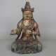 Guanyin-Figur-- geschnitzte Holzskulptur einer in ardha padmasana sitzenden Guanyin, mit Resten der farbigen Fassung, im Kopfschmuck ist Buddha Amitabha dargestellt, Abrieb, leichte Substanzverluste, Rissbildung, H. ca.40 cm, China - фото 1