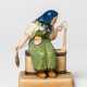 A RUSSIAN PORCELAIN FIGURE SHOWING A FARMER'S WIFE SPINNING - photo 1
