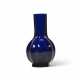 A TRANSLUCENT BLUE GLASS FLUTED BOTTLE VASE - photo 1