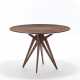 Round table with structure in solid mahogany and veneer, four double fork legs. Italy, 1950s/1960s. (h 81 cm.; d 119 cm.) (slight defects) - photo 1