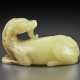 A PALE YELLOW JADE FIGURE OF A RECUMBENT MYTHICAL BEAST - фото 1