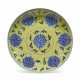 A YELLOW-GROUND BLUE AND WHITE `LOTUS’ DISH - photo 1