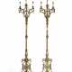 A PAIR OF FRENCH GILT-BRONZE AND POLISHED BRASS THREE-LIGHT TORCHERES - photo 1