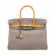A CUSTOM GRIS ASPHALTE & AMBRE SWIFT LEATHER BIRKIN 35 WITH BRUSHED GOLD HARDWARE - Foto 1