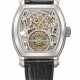 VACHERON CONSTANTIN. A RARE AND HIGHLY ATTRACTIVE PLATINUM TONNEAU-SHAPED SKELETONIZED TOURBILLON WRISTWATCH WITH POWER RESERVE, DATE, CERTIFICATE OF ORIGIN AND BOX - Foto 1