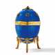 Decorative egg with violet blue enamel decor and set with gemstones - фото 1