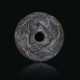 A GREEK BLACK STEATITE PERFORATED DISC WITH THREE HORSES - Foto 1