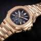 PATEK PHILIPPE, NAUTILUS REF. 5980/1R-001, A GOLD AUTOMATIC CHRONOGRAPH WRISTWATCH - Foto 1