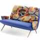 Two seater sofa upholstered in blue fabric and polychrome printed fabric with an abstract subject signed by Mauro Reggiani. Truncated conical legs in brass-plated metal casting. Italy, 1950s/1960s. (132x83x71 cm.) (slight defects) - фото 1