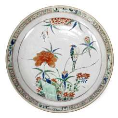 Polychrome decorated porcelain plate with bird and flowers Polychrome decorated porcelain plate with bird and flowers
