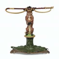 A LATE VICTORIAN POLYCHROME-PAINTED CAST-IRON UMBRELLA STAND... A LATE VICTORIAN POLYCHROME-PAINTED CAST-IRON UMBRELLA STAND...