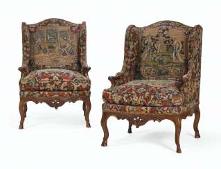 A PAIR OF EARLY LOUIS XV WALNUT BERGERES A OREILLES A PAIR OF EARLY LOUIS XV WALNUT BERGERES A OREILLES
