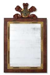 A CENTRAL EUROPEAN PARCEL-GILT AND EBONIZED MAHOGANY MIRROR A CENTRAL EUROPEAN PARCEL-GILT AND EBONIZED MAHOGANY MIRROR