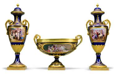 A FRENCH ORMOLU-MOUNTED SEVRES-STYLE BLUE-GROUND PORCELAIN NAPOLEONIC THREE-PIECE GARNITURE A FRENCH ORMOLU-MOUNTED SEVRES-STYLE BLUE-GROUND PORCELAIN NAPOLEONIC THREE-PIECE GARNITURE