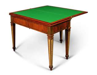 A PAIR OF GERMAN ORMOLU AND BRASS-MOUNTED MAHOGANY MECHANICAL GAMES TABLE A PAIR OF GERMAN ORMOLU AND BRASS-MOUNTED MAHOGANY MECHANICAL GAMES TABLE