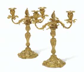A PAIR OF LOUIS XV ORMOLU TWIN-LIGHT CANDELABRA A PAIR OF LOUIS XV ORMOLU TWIN-LIGHT CANDELABRA