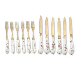 A SILVER-GILT MOUNTED FRENCH PORCELAIN PART FLATWARE SERVICE A SILVER-GILT MOUNTED FRENCH PORCELAIN PART FLATWARE SERVICE