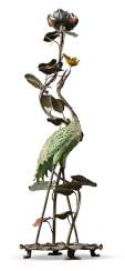 A COLD-PAINTED METAL TORCHERE MODELLED AS A CRANE A COLD-PAINTED METAL TORCHERE MODELLED AS A CRANE
