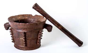 A very large Gothic Italian mortar with pestle A very large Gothic Italian mortar with pestle