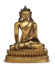 A GILT-COPPER FIGURE OF A CROWNED BUDDHA A GILT-COPPER FIGURE OF A CROWNED BUDDHA