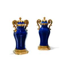 A PAIR OF MONUMENTAL LOUIS XVI ORMOLU-MOUNTED CHINESE BLUE PORCELAIN TWIN-HANDLED VASES A PAIR OF MONUMENTAL LOUIS XVI ORMOLU-MOUNTED CHINESE BLUE PORCELAIN TWIN-HANDLED VASES