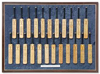 A FRAMED DISPLAY OF 23 MINIATURE BATS A FRAMED DISPLAY OF 23 MINIATURE BATS