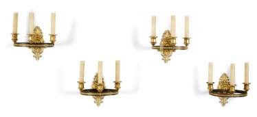A SET OF FOUR EMPIRE ORMOLU AND PATINATED-BRONZE THREE-BRANCH WALL-LIGHTS A SET OF FOUR EMPIRE ORMOLU AND PATINATED-BRONZE THREE-BRANCH WALL-LIGHTS