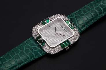 AUDEMARS PIGUET, A LADIES WHITE GOLD WRISTWATCH SET WITH DIAMONDS AND EMERALDS AND A PAVED DIAL AUDEMARS PIGUET, A LADIES WHITE GOLD WRISTWATCH SET WITH DIAMONDS AND EMERALDS AND A PAVED DIAL