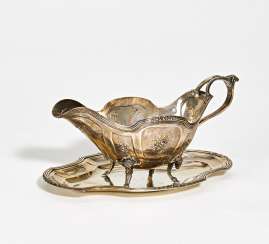 Silver gravy boat with ram decor on saucer Silver gravy boat with ram decor on saucer