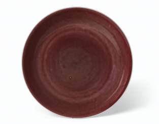 A COPPER-RED-GLAZED DISH A COPPER-RED-GLAZED DISH
