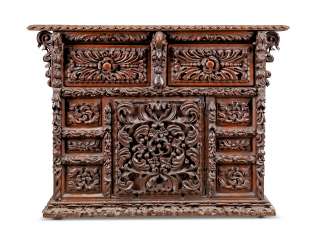 A SPANISH CARVED WALNUT CHEST A SPANISH CARVED WALNUT CHEST