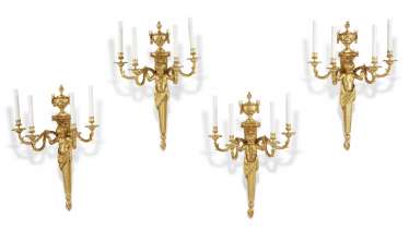 A SET OF FOUR FRENCH ORMOLU FOUR-BRANCH WALL-LIGHTS OF LARGE SCALE A SET OF FOUR FRENCH ORMOLU FOUR-BRANCH WALL-LIGHTS OF LARGE SCALE