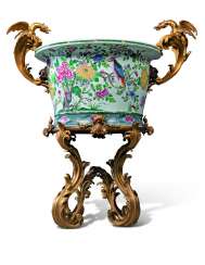 A LARGE FRENCH ORMOLU-MOUNTED CHINESE FAMILLE ROSE PORCELAIN JARDINIERE-ON-STAND A LARGE FRENCH ORMOLU-MOUNTED CHINESE FAMILLE ROSE PORCELAIN JARDINIERE-ON-STAND