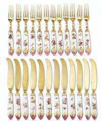 A SILVER-GILT MOUNTED GERMAN PORCELAIN PART FLATWARE SERVICE A SILVER-GILT MOUNTED GERMAN PORCELAIN PART FLATWARE SERVICE