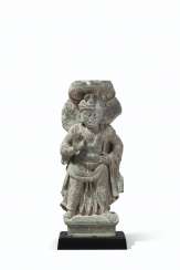 A GREEN SCHIST FIGURE OF A BODHISATTVA A GREEN SCHIST FIGURE OF A BODHISATTVA