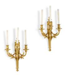 A PAIR OF LOUIS XVI ORMOLU THREE-BRANCH WALL-LIGHTS A PAIR OF LOUIS XVI ORMOLU THREE-BRANCH WALL-LIGHTS