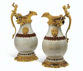 A PAIR OF RESTAURATION ORMOLU-MOUNTED CHINESE CRACKLE-GLAZED VASES MOUNTED AS EWERS A PAIR OF RESTAURATION ORMOLU-MOUNTED CHINESE CRACKLE-GLAZED VASES MOUNTED AS EWERS