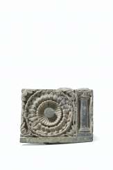 A GREEN SCHIST DECORATIVE RELIEF WITH A LOTUS AND COLUMN A GREEN SCHIST DECORATIVE RELIEF WITH A LOTUS AND COLUMN