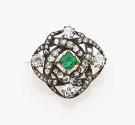 Brooch with diamonds and emerald Brooch with diamonds and emerald