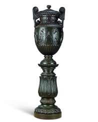 A CAST IRON URN AND PEDESTAL A CAST IRON URN AND PEDESTAL