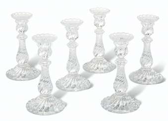 A GROUP OF SIX BACCARAT SPIRAL-MOLDED GLASS CANDLESTICKS A GROUP OF SIX BACCARAT SPIRAL-MOLDED GLASS CANDLESTICKS