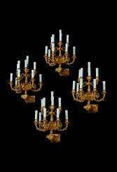 A SET OF FOUR FRENCH ORMOLU EIGHT-LIGHT WALL-APPLIQUES A SET OF FOUR FRENCH ORMOLU EIGHT-LIGHT WALL-APPLIQUES