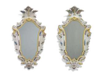 A PAIR OF NORTH ITALIAN POLYCHROME-DECORATED MAIOLICA MIRROR-FRAMES A PAIR OF NORTH ITALIAN POLYCHROME-DECORATED MAIOLICA MIRROR-FRAMES