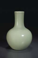 A SMALL CELADON-GLAZED GLOBULAR BOTTLE VASE A SMALL CELADON-GLAZED GLOBULAR BOTTLE VASE