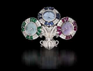 AUDEMARS PIGUET, A UNIQUE GOLD BROOCH WITH 3 QUARTZ WATCHES SET WITH DIAMONDS, RUBIES, SAPPHIRES, AND EMERALDS, ENGRAVED NO. 1 AUDEMARS PIGUET, A UNIQUE GOLD BROOCH WITH 3 QUARTZ WATCHES SET WITH DIAMONDS, RUBIES, SAPPHIRES, AND EMERALDS, ENGRAVED NO. 1