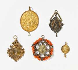 Five partially gilt silver amulets Five partially gilt silver amulets