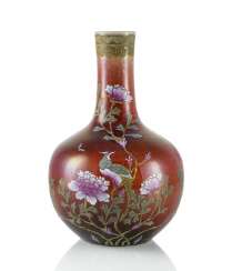 Bottle vase made of porcelain with copper red glaze and Famille rose decor Bottle vase made of porcelain with copper red glaze and Famille rose decor