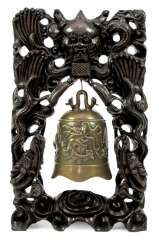 Bronze bell with dragon decoration in carved wood frame with silver deposits Bronze bell with dragon decoration in carved wood frame with silver deposits