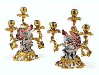 A PAIR OF LOUIS XV ORMOLU-MOUNTED ARITA PORCELAIN THREE-LIGHT CANDELABRA A PAIR OF LOUIS XV ORMOLU-MOUNTED ARITA PORCELAIN THREE-LIGHT CANDELABRA